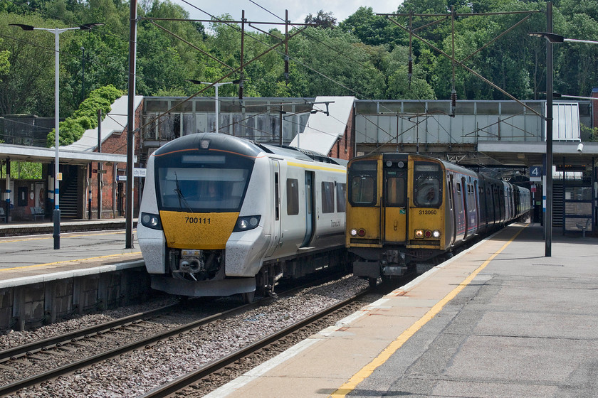 700111, TL 12.23 Horsham-Peterborough (9J36, 7L) & 313060, GN 13.30 Moorgate-Welwyn Garden City (2V75, 1E), Hadley Wood station 
 Two trains from totally different eras pass at Hadley Wood station. To the left, 700111 working the Thameslink 12.23 Horsham to Peterborough service passes on the down fast whilst to the right, veteran 313060 slows for its stop with the 13.30 Moorgate to Welwyn Garden City. It will not be long before the forty-year-old class 313 will be scrapped along with its remaining class mates bringing to an end another era on the network. 
 Keywords: 700111 12.23 Horsham-Peterborough 9J36 313060 13.30 Moorgate-Welwyn Garden City 2V75 Hadley Wood station