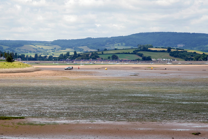 Class 43, GW 10.06 London Paddington-Penzance (1C77, 14L), between Stracross & Cockwood from Exmouth 
 Sitting on the prom. at Exmouth waiting for Andy offered a superb panorama across the Exe Estuary. As I sat there, I managed to capture an HST forming the 10.06 Paddington to Penzance passing on the far side. Looking at the OS map it will have been between Stracross and Cockwood Harbour. 
 Keywords: Class 43 1C77 between Stracross & Cockwood from Exmouth