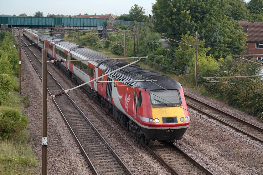 43318, 07.15 Leeds-London Kings Cross (1A09, RT), Arlesey footbridge 
 The 07.15 Leeds to King's Cross is into the final 35 miles of its journey as it passes Arlesey in Bedfordshire. Leading the train is 43318. This was part of the final ECML HST set 254032 originally numbered 43118. 
 Keywords: 43318 1A09 Arlesey footbridge