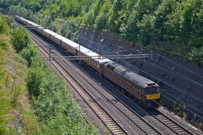 47746 & 47826, 12.10 Acton Exchange Sidings-Crewe CS (5Z32), Roade Cutting 
 47746 leads the 12.10 Acton Exchange Sidings to Crewe Carriage Sidings ECS stock move through Roade Cutting. A working such as this would normally take the Northampton line here and therefore be on the down slow. But, as the Northampton loop was closed for engineering works, the train had to travel on the fast via Weedon. This did cause some inevitable slow running for the rains that were following it largely running on cautions until the train had cleared Rugby. 
 Keywords: 47746 47826 12.10 Acton Exchange Sidings-Crewe CS 5Z32 Roade Cutting