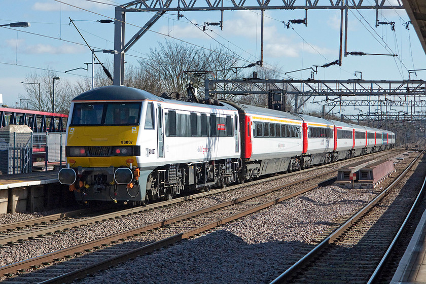 90007, LE 10.00 London Liverpool Street-Norwich (1P18), Colchester station 
 The 10.00 1P18 service from London Liverpool Street to Norwich is pushed out of Colchester station by an immaculate 90007 'Sir John Betjeman'. This name was previously carried by 86229 until its withdrawal and storage. 
 Keywords: 90007 10.00 London Liverpool Street-Norwich 1P18 Colchester station