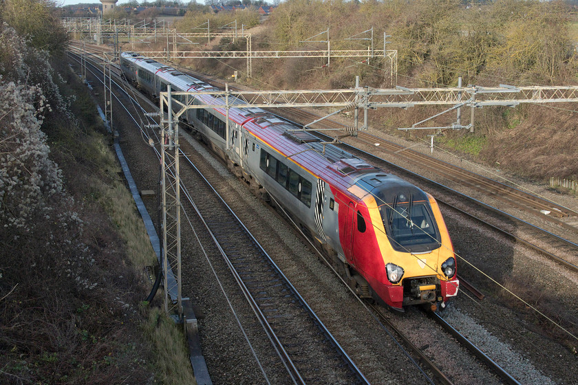 221116, VT 08.55 Holyhead-London Euston (1A23, 8L), Victoria bridge 
 Looking exactly the same as it has done (apart from the removal of the branding) for the last seventeen years since introduction, 221116 'City of Bangor / Dinas Bangor' passes Victoria bridge just south of Roade on the WCML forming the 08.55 Holyhead to Euston service. However, things are set to change in the next two years. Firstly, the Voyager will lose its Virgin livery as it is now operated by Avanti West Coast and, secondly, it will be withdrawn from service on this route to be replaced by a number of bi-mode sets that are presently on-order. 
 Keywords: 221116 08.55 Holyhead-London Euston 1A23 Victoria bridge Avanti West Coast Voyager City of Bangor Dinas Bangor