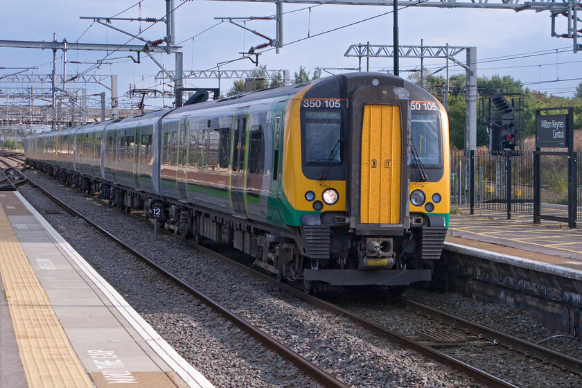 350105, LM 15.54 London Euston-Birmingham New Street (2Y21), Milton Keynes Central station 
 Taken the wrong side for the sun at Milton Keynes station 350105 arrives with the 15.54 Euston to Birmingham London Midland Service. For the middle of September, it was a pleasantly warm afternoon as was the weekend as a whole making the evening outdoor Proms concert in Hyde Park an enjoyable event. 
 Keywords: 350105 15.54 London Euston-Birmingham New Street 2Y21 Milton Keynes Central station London Midland Desiro