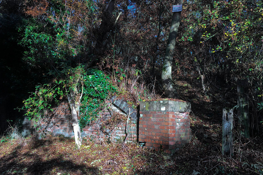 Former SMJ railway bridge abutment, Stoke Bruerne SP738505 
 A bridleway drops down from the Stoke Bruerne to Blisworth road to the Grand Union canal just north of Stoke Bruerne village. The bridleway emerges just next to the south portal of the 1.7 mile long Blisworth tunnel. About half way down this bridleway it used to pass under the SMJ railway through a brick bridge. The abutment of the bridge is seen in this picture now very overgrown but stubbornly intact! 
 Keywords: Former SMJ railway bridge abutment Stoke Bruerne SP738505