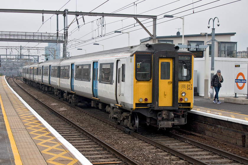 317342, LE 13.24 London Liverpool Street-Cambridge (2H30, 1E), Bethnal Green station 
 On of the original class 317/1s, 317342 passes through Bethnal Green station working the 13.24 Liverpool Street to Cambridge. Time has been called on this unit and the others of this class as the new class 720s are set to be introduced. Their final journey will be to the scrap man 
 Keywords: 317342 13.24 London Liverpool Street-Cambridge 2H30 Bethnal Green station