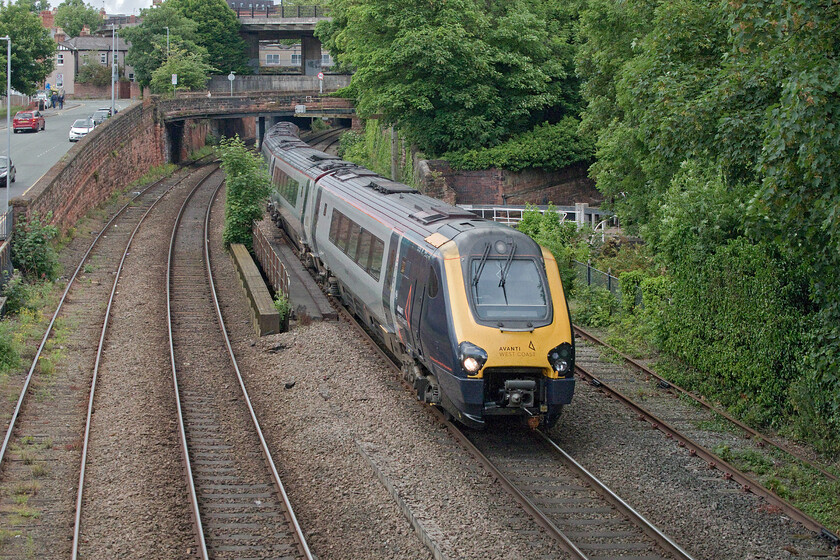 221113, VT 16.10 London Euston-Bangor (1D90, 1L), Bonewaldesthorne's Tower Chester city wall 
 221113 takes the sharp curve just west of Chester having emerged from a short tunnel working Avanti's 16.10 Euston to Bangor service. I am standing on Chester city wall that was cut through by the Victorians when the railways arrived in the city. Just to my left is the impressive Medievil Bonewaldesthorne's Tower which is a historic part of the city wall circuit, see.... https://en.wikipedia.org/wiki/Bonewaldesthorne%27s_Tower 
 Keywords: 221113 16.10 London Euston-Bangor 1D90 Bonewaldesthorne's Tower Chester city wall Avanti West Cost Voyager