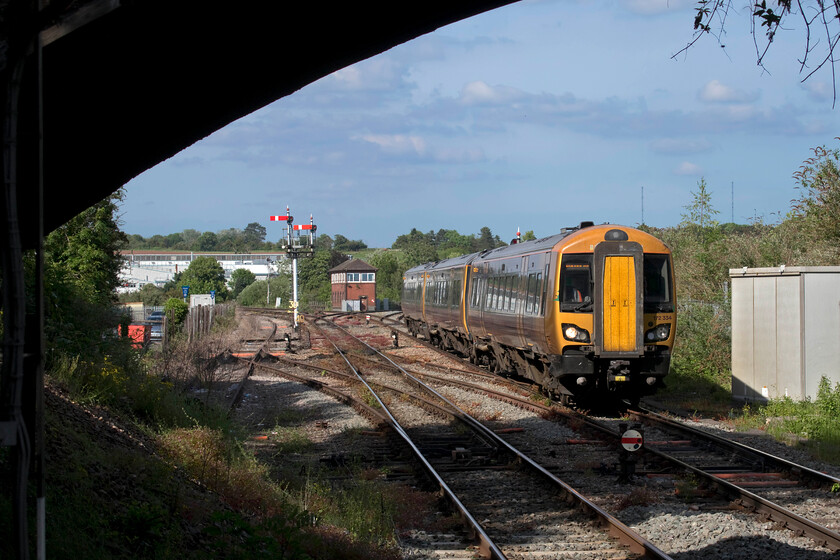 172334, LN 17.00 Birmingham Moore Street-Worcester Foregate Street (2V48, 16L), Droitwich station 
 Like Shrewsbury earlier in the day, Droitwich and nearby Worcester remain bastions of mechanical signalling. With the lovely 1907 GWR signal box in the background, 172334 approaches the station working the late-running 17.00 Birmingham Moore Street to Worcester Foregate Street 2V48 service. At this time of the afternoon, the sun is just right for photography at Droitwich with the arch of the brick bridge nicely framing the image. 
 Keywords: 172334 17.00 Birmingham Moore Street-Worcester Foregate Street 2V48 Droitwich station west Midlands Trains