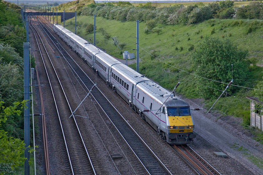 82208, GR 16.05 Leeds-London King's Cross (1A40), New England bridge TL219796 
 The sun has just dived behind a cloud as the 16.05 Leeds to King's Cross East Coast heads south near Connington. DVT 82208 is leading the train that is about to pass under New England bridge. 
 Keywords: 82208 16.05 Leeds-London King's Cross 1A40 New England bridge TL219796 East Coast DVT