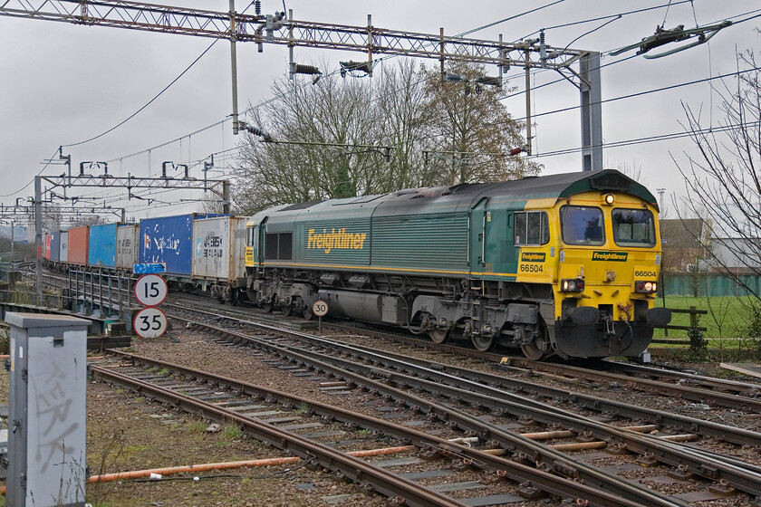 66504, down Freightliner, Northampton station car park 
 A down Freightliner service approaches Northampton taken from the station car park led by 66504. This has been a favoured spot and a popular meeting point for the local enthusiasts for many years but with the new station about to be constructed, there are rumours that it is going to be closed off from the general public and enthusiasts alike. 
 Keywords: 66504 Freightliner Northampton station car park