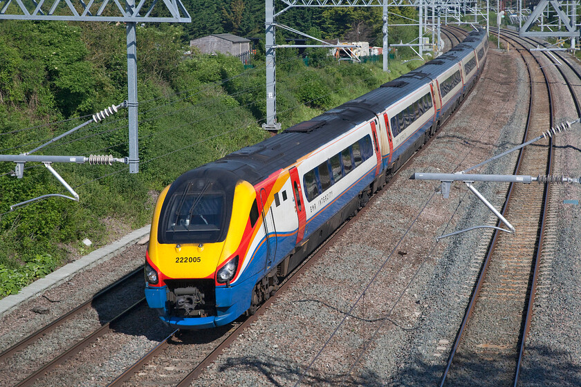 222005, EM 07.31 Sheffield-London St. Pancras (1C20, 2L), Sharnbrook TL001598 
 Formally named 'City of Nottingham' 222005 sweeps down Sharnbrook bank approaching the junction of the same name forming the 1C20 07.31 Sheffield to St. Pancras train. Whilst electrification is the inevitable next phase of railway evolution as a photographer I am not a fan. As can be seen here a previously wide-open view of the line has been severely compromised. 
 Keywords: 222005 07.31 Sheffield-London St. Pancras 1C20 Sharnbrook TL001598 EMR Meridian