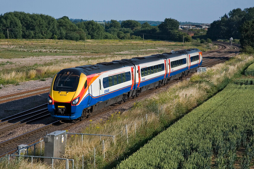 222103, EM 17.30 London St. Pancras-Nottingham, Harrowden Junction 
 222103 passes Harrowden Junction working EMT's 17.30 St. Pancras to Nottingham service. It is a stunning summer's evening with the lower lighting (when compared to the high sun and deep shadows during the day) adding a super quality to the image. 
 Keywords: 222103 17.30 London St. Pancras-Nottingham Harrowden Junction EMT Meridian