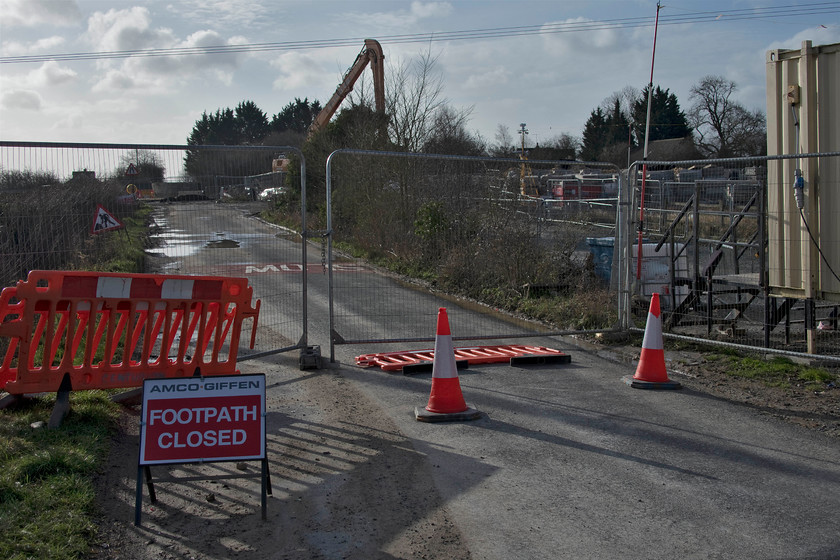 Road closure & embankment reinforcement work, Ashton Road bridge 
 In theory, this road, that links the villages of Ashton and Roade in Northamptonshire, should be reopened in exactly a week's time. However, I suspect that the contractor for Network Rail, Amco Giffen, will have to apply for an extension of the closure as the work does not look like it will be completed by then. The delay to the embankment reinforcement work has been mainly weather-related as is to be expected during January and February I suppose. 
 Keywords: Road closure embankment reinforcement work Ashton Road bridge Roade