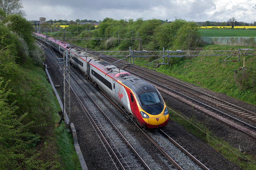 390123, VT 12.00 Glasgow Central-London Euston (9M55, 2L), Victoria Bridge 
 In dramatic lighting at Victoria Bridge near to Roade on the WCML 390123 'Virgin Glory' forms the 12.00 Glasgow Central to London Euston. The threatening skies in the background did exactly what it looks like likely they would do in the following twenty minutes or so! 
 Keywords: 390123 9M55 Victoria Bridge