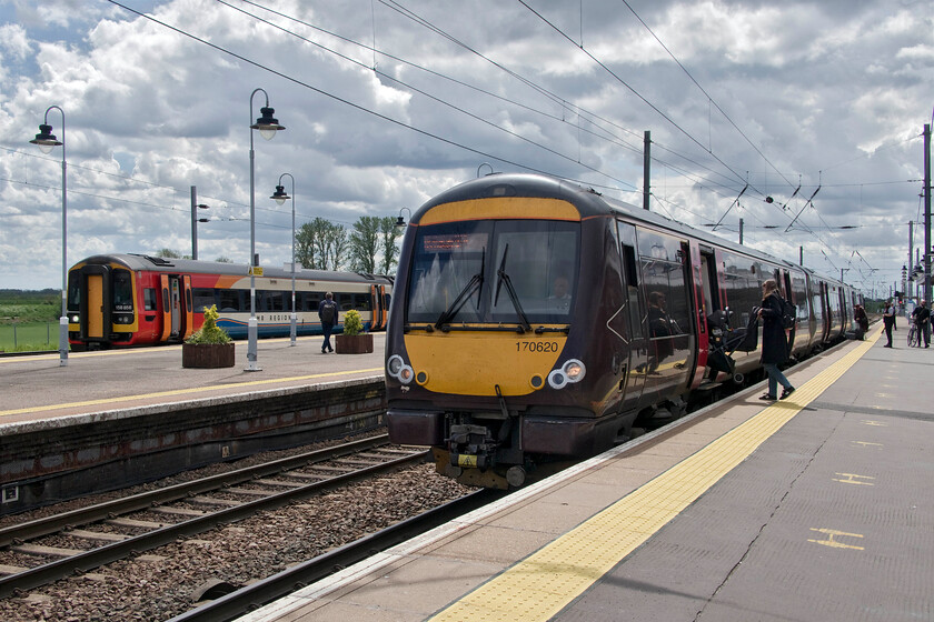 158856, EM 11.41 Nottingham-Norwich (1L08, 3L) & 170620, XC 12.27 Stansted Airport-Birmingham New Street (1N55, 4L), Ely station 
 Ely has always been and remains a busy station deep in the Fens with frequent train services from a number of operators and frequent freight. It is often somewhat overlooked by railway enthusiasts that always seems a little surprising to me especially as we were simply waved through the barriers by the gate staff. In this scene, EMR's 158856 is soon going to close its doors and depart as the 1L08 11.41 Nottingham to Norwich service. In the foreground, 170620 is boarding working CrossCounty's 12.27 Stansted Airport to Birmingham New Steet train. 
 Keywords: 158856 11.41 Nottingham-Norwich 1L08 170620 12.27 Stansted Airport-Birmingham New Street 1N55 Ely station EMR EMT East Midlands Trains XC CrossCountry