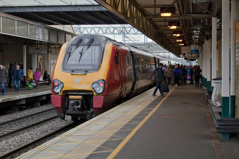 221104, VT 06.52 Holyhead-London Euston (1A15, RT), Milton Keynes Central station 
 221104 'Sir John Franklin' pauses at Milton Keynes Central station forming the 06.52 Holyhead to Euston. On its last day of operation with Virgin Trains, the famous nose cone Virgin badge is no longer present, has it been officially removed at a depot or purloined by a trophy hunter one wonders? 
 Keywords: 221104 06.52 Holyhead-London Euston 1A15 Milton Keynes Central station Voyager Virgin West Coast Trains Sir John Franklin