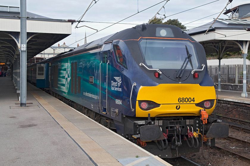 68004 & 68024, LE 12.05 Norwich-Lowestoft (2J74), Norwich station 
 In Norwich station, 68004 'Rapid' sist at the head of the 2J74 12.05 to Lowestoft. Out of site on the rear is 68024 'Centaur'. A total of 7600 hp is ample to get three BR Mk.IIA moving across the flat Fenland countryside. Indeed, travelling on the train revealed that the power handle was used in short bursts and when it was it resulted in rapid acceleration. 
 Keywords: 68004 68024 12.05 Norwich-Lowestoft 2J74 Norwich station