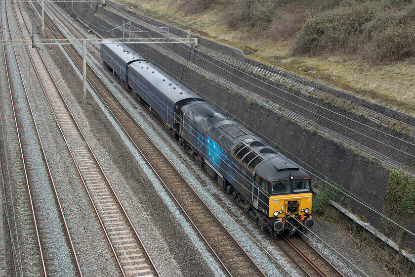 57312, 10.16 Derby RTC-Wembley Yard (5H72, 8E), Roade cutting 
 Running a little early and almost catching me out the 5H72 10.16 Derby RTC to Willesden Yard passes through Roade cutting led by 57312. I am not at all sure as to why Rail Operations Group were moving the two converted coaches southwards but as they usually act as barriers during stock movement then perhaps there is something else to be kept an eye out for later this week! 
 Keywords: 57312 10.16 Derby RTC-Wembley Yard 5H72 Roade cutting Rail Operations Group ROG