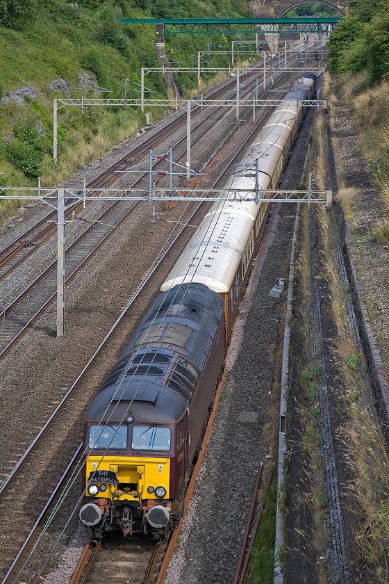 57315, outward leg of The Royal Windsor Statesman, 06.55 Crewe-Windsor & Eton Riverside (1Z55), Roade cutting 
 Former Virgin Thunderbird 57315 leads the outward leg of Statesman Rail's The Royal Windsor Statesmen charter through Roade cutting. The Class 57, formally a Thunderbird named 'The Mole' looks far less glamorous in its drab West Coast Railways livery than when in Virgin red. The charter left Crewe at 06.55 taking its passengers in relative luxury to Windsor and Eton Riverside. 
 Keywords: 57315 outward leg of The Royal Windsor Statesman 06.55 Crewe-Windsor & Eton Riverside 1Z55 Roade cutting WCR West Coast railwas Thunderbird The Mole