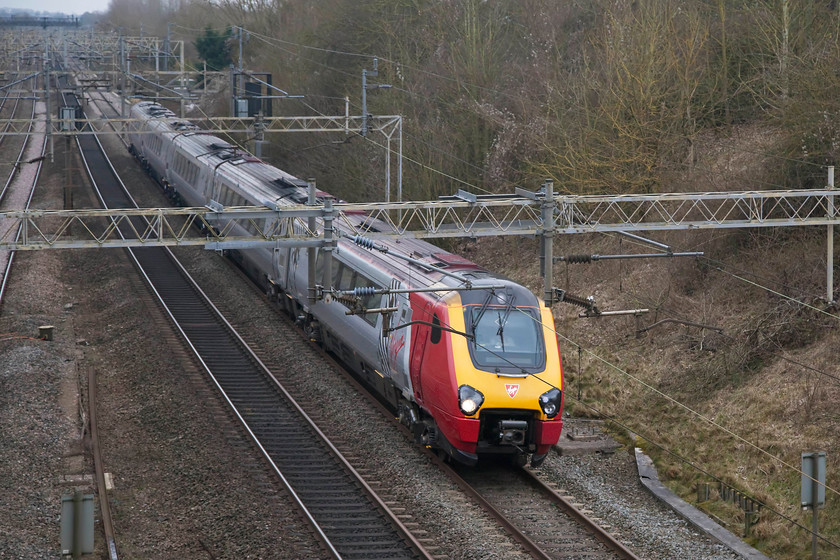 Class 221, VT 15.10 London Euston-Chester (1D89, 2E), Victoria Bridge 
 Getting the numbers of class 221s, and for that matter the 220s, is very difficult when they are on the move as in this image. The numbers are placed very low down and in a small font. This unidentified class 221 is forming the 15.10 London Euston to Chester working and is seen passing Victoria Bridge between Milton keynes and Rugby on the WCML. 
 Keywords: Class 221 1D89 Victoria Bridge