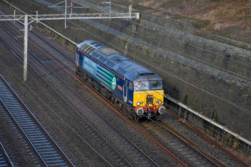 57302, up LE ex Rugby, Roade cutting 
 Former Virgin Thunderbird 57302 now named 'Chad Varah' and operated by DRS passes through Roade cutting having left Rugby on an unidentified move to Wembley. The initial batch of twelve Class 57s was constructed in 2002/03 with another four a short while later in order to tow the Pendolinos along the North Wales coast to and from Crewe. Dubbed as Thunderbirds they are still stabled up and down the WCML at strategic locations but I can't quite help thinking that the DRS livery is not quite as dramatic as the initial Virgin livery! 
 Keywords: 57302 Rugby Roade cutting Chad Varah DRS Direct Rail Services