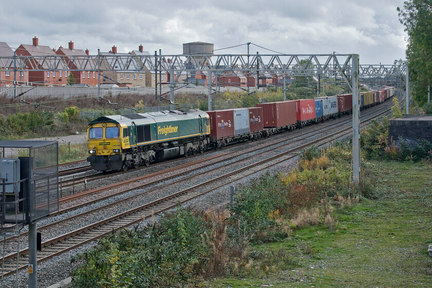 66598, 08.45 Ipswich-Lawley Street (4M94, 3E), site of Roade station 
 The 4M94 Freightliner is seen being led past Roade under rather gloomy skies by 66598. I have a number of photographs of this particular locomotive but most are in other parts of the country including Barnetby and Doncaster. 
 Keywords: 66598 08.45 Ipswich-Lawley Street 4M94 site of Roade station Freightliner