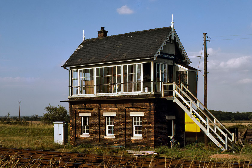 Potterhanworth signal box (GN, 1883) 
 The delightfully named Potterhanworth signal box looks absolutely superb in the afternoon sunshine. The Great Northern always made a great deal of effort with the details of their boxes when they were constructed and this 1883 example was no exception. The ornate wooden gable end detailing is superb especially the way that it seamlessly blends into the finials. This Type 1 box is the second at this location with the first one only being a year older but that was destroyed by a storm. The thirty-two lever Saxby & Farmer frame was rescued from the debris and reused in this box. 
 Keywords: Potterhanworth signal box Great Northern Railway GNR