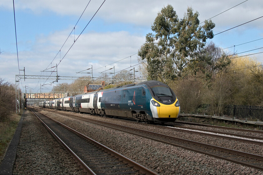 390132, VT 12.35 Manchester Piccadilly-London Euston (1A39, 3E), Cathiron SP4667783 
 A pretty mundane photograph of 390132 passing Cathiron working the 12.35 Manchester Piccadilly to Euston service. However, I was so overcome with joy that the sun had come out that I fired off the shot through the wire railings of the footbridge totally blind without using either the viewfinder or the fold-out screen and hoping for the best! Apart from a little bit of straightening up the digital image needed no other work, quite remarkable really! 
 Keywords: 390132 12.35 Manchester Piccadilly-London Euston 1A39 Cathiron SP4667783 AWC Avanti West Coast Pendolino