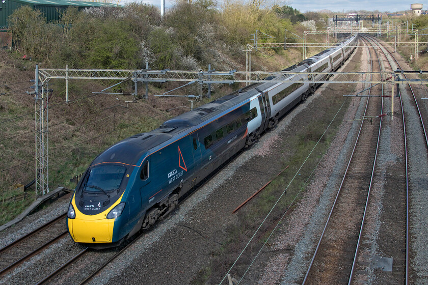 350011, VT 08.38 Liverpool Lime Street-London Euston (1A05, 5E), Victoria bridge 
 With the front of the train just avoiding the full sun 390011 'City of Lichfield' passes Victoria bridge just south of Roade in Northamptonshire working the 08.38 Liverpool to Euston train. Despite the bright sun it was an unseasonally cold day with a very brisk north-easterly wind blowing with it feeling more like January than early April! 
 Keywords: 350011 08.38 Liverpool Lime Street-London Euston 1A05 Victoria bridge Avanti West Coast Pendolino City of Lichfield