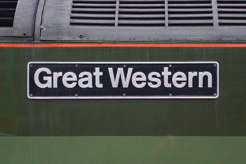 Nameplate, 47815, outward leg of The Cumbrian Mountain Express, 06.35 London Euston-Carlisle (1Z86, 4E), Milton Keynes station 
 It is nice to see the tradition of locomotives carrying 'proper' nameplates rather than vinyls as is all too common today! 47815 'Great Western' pauses at Milton Keynes station leading the outward leg of the Cumbrian Mountain Express charter. Unlike the first CME of the year back at the end of January, this one ran bang to time with no problems encountered. I heard it returning in the late evening running to time passing my home in Roade with the Class 47 working well! 
 Keywords: Nameplate 47815 The Cumbrian Mountain Express, 06.35 London Euston-Carlisle 1Z86 Milton Keynes station