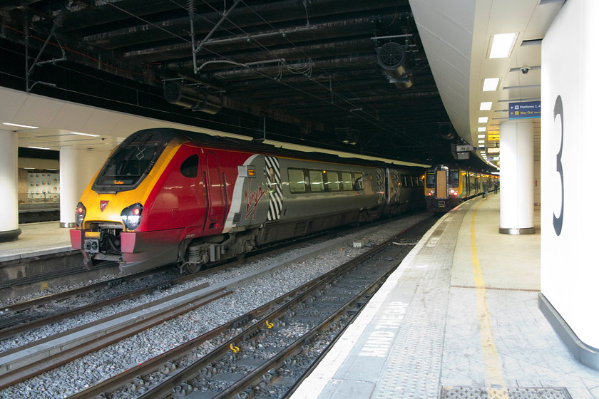 221101, VT 15.24 Shrewsbury-London Euston (1B53) & 350111, LM 16.14 Birmingham New Street-London-Euston (2Y46), Birmingham New Street station 
 221101 'Louis Blriot' sits at Birmingham New Street's platform four with the 15.24 Shrewsbury to London EustonNext to it on platform three 350111 waits to leave with the 16.14 to Euston. My son and I took this train back to Northampton. 
 Keywords: 221101 15.24 Shrewsbury-London Euston 1B53 350111 16.14 Birmingham New Street-London-Euston 2Y46 Birmingham New Street station