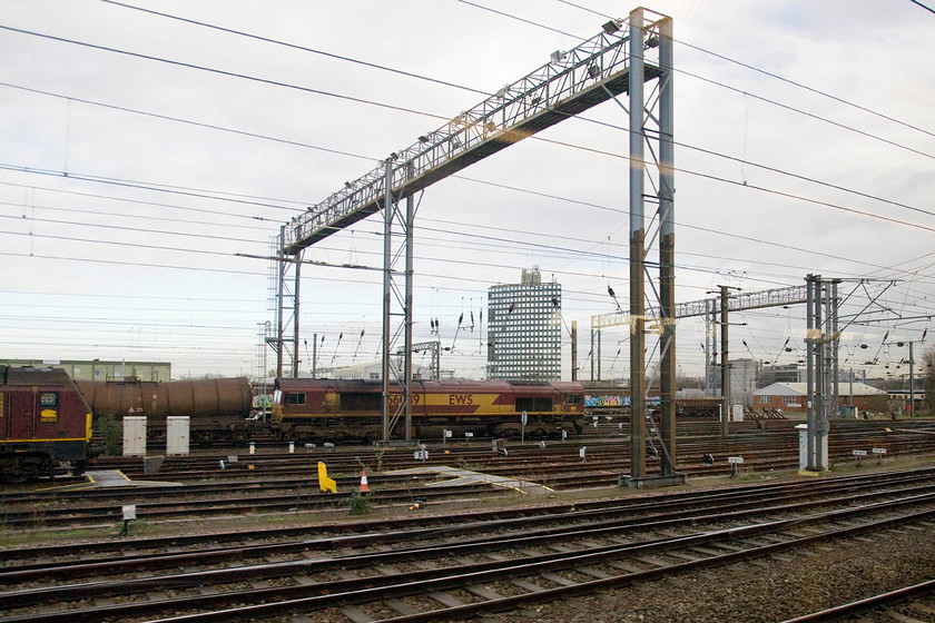 67023 & 66039, stabled, Wembley yard 
 With 67023 just poking its nose into the left of the image, 66039 is seen leading a tanker train facing south in Wembley yard. 
 Keywords: 67023 66039 stabled Wembley yard