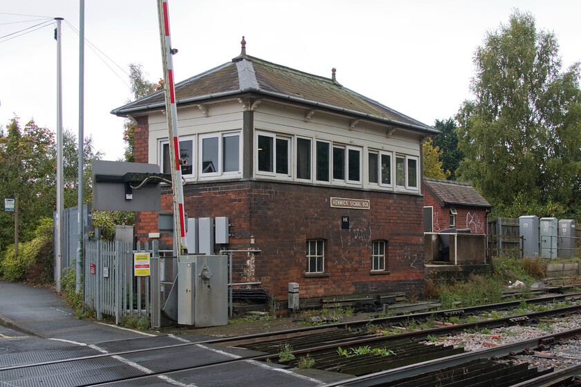 Henwick signal box (McK & H GW, 1875) 
 Henwick signal box is located to the west of Worcester and is a McKenzie & Holland type 1 structure dating from 1875. It controls the busy level crossing in the foreground as well as a number of semaphores and the turnback sidings to the west. These sidings enable terminating Foregate services to be temporarily stabled and to return right line back to the station if required. There used to be a station at Henwick, the platforms of which would have started about where the relay boxes are sited. The station closed on 05.04.65. I have read somewhere that this box is scheduled for replacement in the distant futrure with a date of 2048 suggested; commets please! 
 Keywords: Henwick signal box