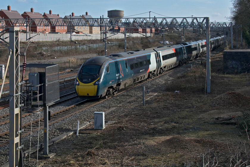 390016, VT 12.40 London Euston-Edinburgh Waverley (9S70, 6L), site of Roade station 
 Avanti's 390016 sweeps past the site of Roade's former station working the 9S70 12.40 Euston to Edinburgh Waverley service. It is a remarkable thought that 2022 marks the twentieth anniversary of the Class 390s being introduced into service! 
 Keywords: 390016 12.40 London Euston-Edinburgh Waverley 9S70 site of Roade station Avanti West Coast Pendolino