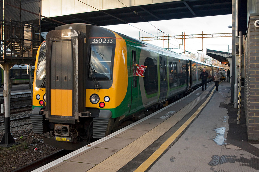 350233, LM 13.54 Birmingham New Street-London Euston (2Y12, 1E), Northampton station 
 Our train to London, this time my wife and Ieft in the afternoon after working half days. 350233 waits at the platform to leave with 13.54 Birmingham to London Euston. It is being serviced during its extended dwell time of about twenty minutes. 
 Keywords: 350233 13.54 Birmingham New Street-London Euston 2Y12 Northampton station