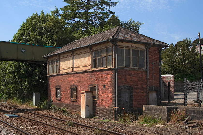 St. Austell signal box (Closed) (GW, 1906) 
 The former St. Austell signal box is a Great Western type 7C design that was opened in 1906. Up until when it closed in 1980, there was also a level crossing immediately beyond the box where the footbridge is constructed. This was provided for pedestrians to continue to cross the line at this point. Considering that it has been out of use for nearly thirty years, it is not in a too bad a condition! 
 Keywords: St. Austell signal box