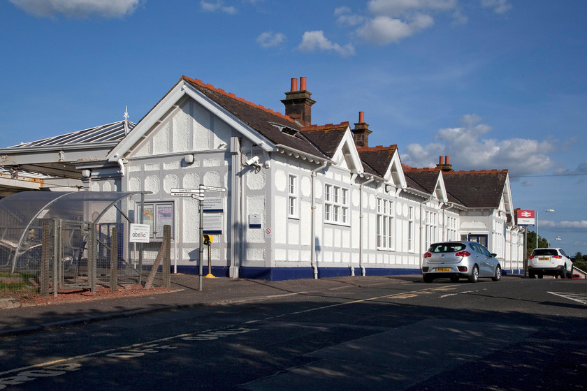 Frontage, Troon station 
 The GSWR station frontage at Troon. It is built in the traditional style of the company sharing many features with a number of other stations. When I visited in 1984 it was painted in a different colour scheme it also had a number of enamel totems. Our hire car can be seen parked in the drop-off zone. 
 Keywords: Frontage, Troon station