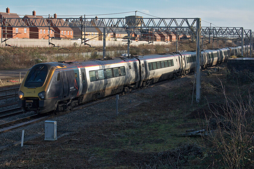 221115 & 221103, VT 13.16 London Euston-Glasgow Central (9S77, 41L), site of Roade station 
 Avanti Voyagers 221115 and 221103 passes Roade in the low winter's afternoon sunshine working the 9S77 13.16 Euston to Glasgow Central. The train left Euston some ten minutes late steadily losing time that was not recovered until it reached Birmingham New Street. However, things went wrong again later in its journey with it losing a lot of time in the northwest being an hour adrift at one stage and eventually arriving forty-one late at its destination; not a great performance from start to finish! 
 Keywords: 221115 221103 VT 13.16 London Euston-Glasgow Central 9S77 site of Roade station Avanti West Coast Voyager