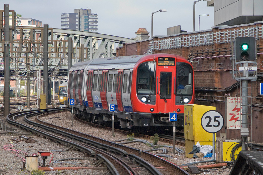 21436, TfL Hammersmith-Barking working (0276), Paddington LU station 
 The S stock was launched in 2009 and has recently been introduced on the District Line replacing the older D78 stock last year. As yet, only limited numbers of the elderly 1978 D78s have been withdrawn with Vivarail taking a fair number of them for possible future re-use. 21436 approaches Paddington station working a Bakerloo Line Hammersmith to Barking working that I took to King's Cross. With this unit being no more than a year old it is somewhat disappointing to see, what appears to be rust stains down the nose cone from the pantograph wiper spindle. 
 Keywords: 21436 Hammersmith-Barking working 0276 Paddington LU station Bakerloo Lone TfL