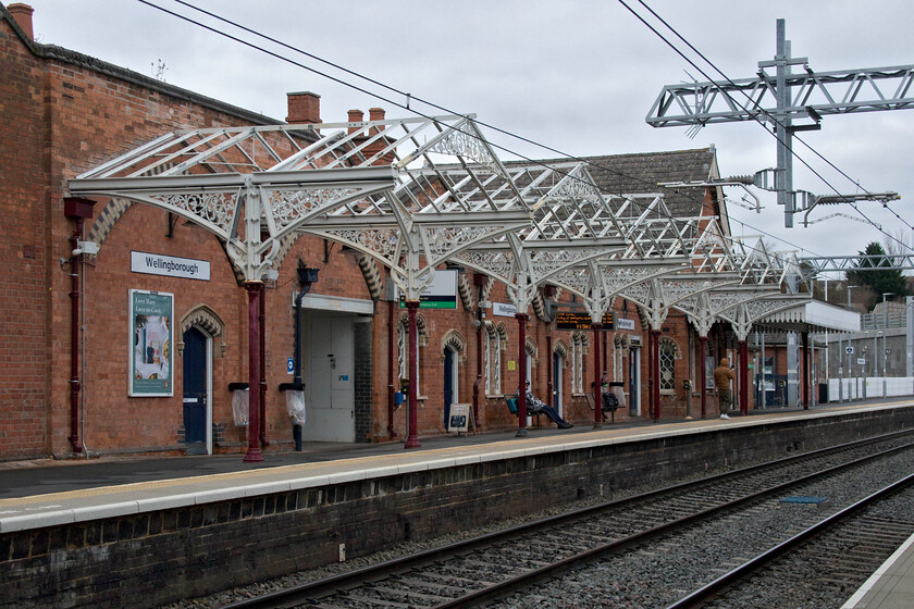 Reinstated canopy, Wellingborough station 
 Back in the winter of 2020, I photographed the carnage at Wellingborough station with the removal of the superb Midland Railway canopies, see...... https://www.ontheupfast.com/p/21936chg/28700323804/platform-1-wellingborough-station However, since then they have been reproduced to the same design and replaced by Network Rail. To complete the job the glazing panels need to be installed to give the passengers on the platform the protection that they should be afforded. 
 Keywords: Reinstated canopy Wellingborough station