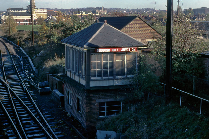 Dudding Hill Junction Signal Box (Midland, C.1902) TQ227858 
 Dudding Hill signal box is a type 3a Midland box dating from circa 1902. Originally, it would have been completely of timber construction but at some time a brick base has been constructed with metal-framed windows installed suggesting that this may have been carried out in the 1930s perhaps as a wartime measure. It looks a little sorry for itself having lost its finials and with mesh protection over the windows. The box still exists and is in use today but looks very different. It has had a clumsy extension added very similar to the one added to Acton Canal Wharf box and it is UPVC clad but retains a slate roof. My 2020 photograph can be seen at ..... https://www.ontheupfast.com/p/21936chg/28768436804/dudding-hill-junction-signal-box 
 Keywords: Dudding Hill Junction Signal Box TQ227858