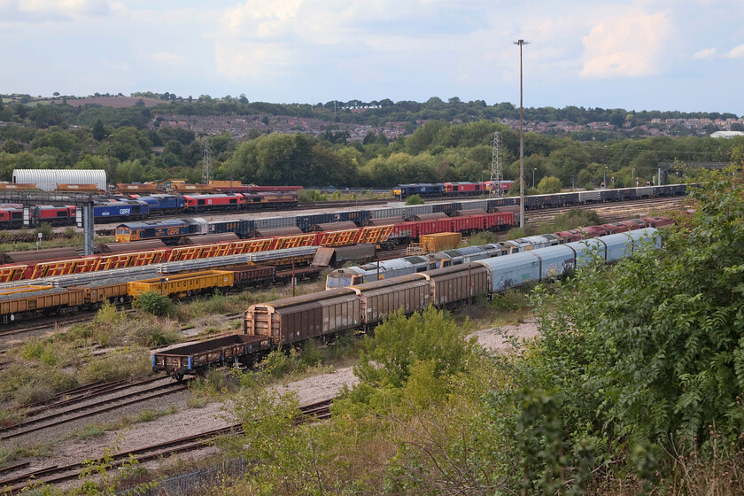 66777, 13.54 Tunstead Sidings-Wellingborough GBRf (6F78, 27E), Toton centre road 
 Just prior to returning to the car at Toton and heading for home I decided to have a quick look at OpenTrainTimes to see if anything of interest was about. It just so happened that the 6F78 13.54 Tunstead Sidings to Wellingborough stone train was ambling its way along the Erewash Valley towards us and was about fifteen minutes away. Unfortunately, after waiting for it, with 66777 'Annette' leading photographic opportunities were somewhat spoilt by it coming to halt for a timed layover behind several rows of wagons! 
 Keywords: Annette 66777 13.54 Tunstead Sidings-Wellingborough GBRf 6F78 Toton centre road