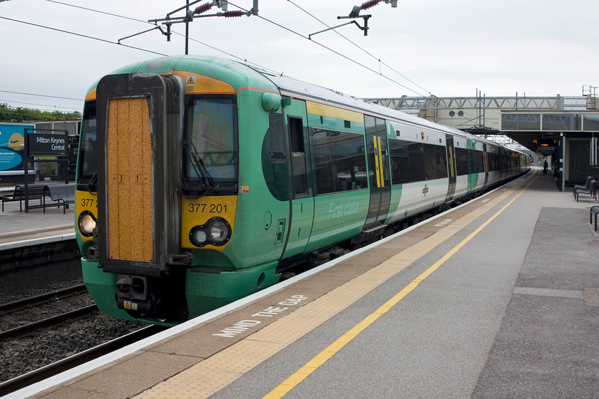 377201, SN 11.13 Milton Keynes-East Croydon (2O35, RT), Milton Keynes station 
 377201 waits to leave Milton Keynes with the 11.13 to East Croydon. My wife and I travelled on this service as far as Kensington Olympia. These class 377 units are amongst the most numerous on the network that are divided into a myriad of sub-classes. There are 15 377/2s, that are dual voltage for use on this line. 
 Keywords: 377201 2O35 Milton Keynes station