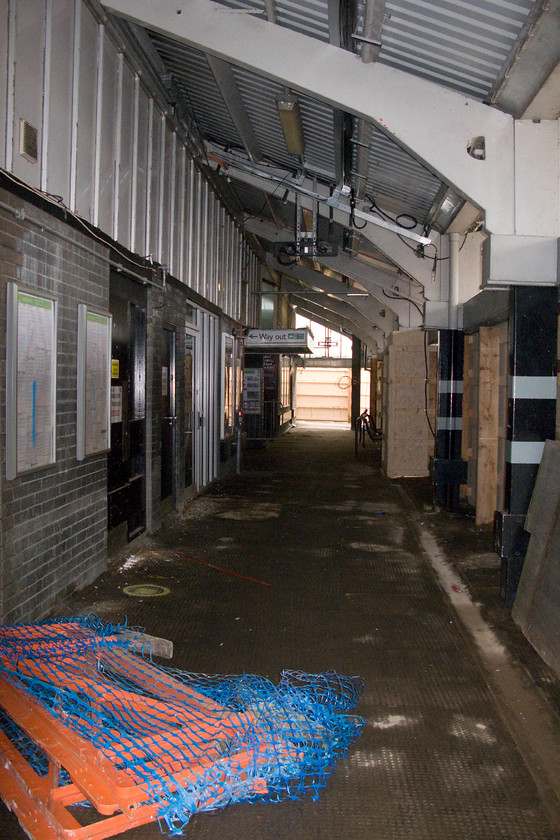 Demolition of old Northampton station 
 With the station having been closed for just three weeks, the former platform facing of the old Northampton station is boarded up and awaiting the demolition ball! This was the former platform one and its main entrance and exit, a pair of double doors that had to handle all of the three million passengers (2013/14) 
 Keywords: Demolition of old Northampton station