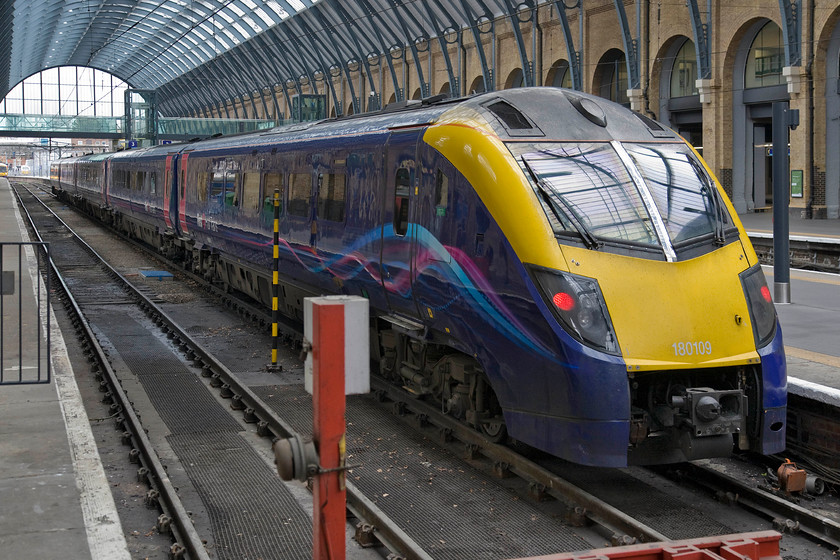 180109, HT 10.42 London King's Cross-Hull (1H02), London King's Cross station 
 A former First Great Western Adelante now is use with Hull Trains that is also part of the First Group is seen at King's Cross. Introduced in 2000 the units have been blighted by reliability issues and still require specialist maintenance to keep them running. They are the only high-speed trains in the world to utilise hydraulic transmission. 180109 waits at the buffers from where it work the 1H02 10.42 service to Hull. 
 Keywords: 180109 10.42 London King's Cross-Hull 1H02 London King's Cross station Hull Trains Adelante