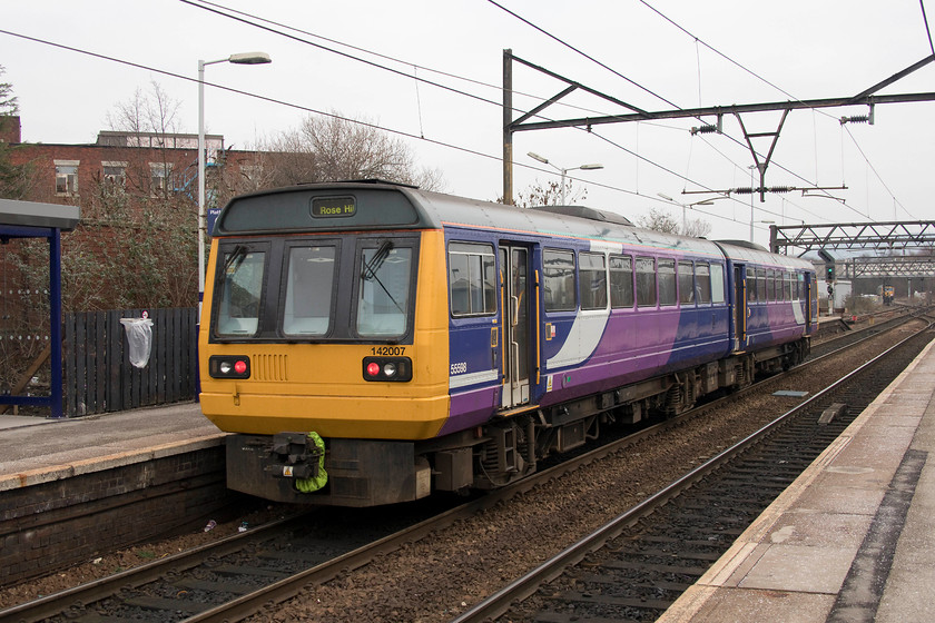 142007, NT 11.09 Manchester Piccadilly-Rose Hill Marple (2R09, RT), Guide Bridge station 
 142007 leaves Guide Bridge station forming the 11.09 Manchester Piccadilly to Rose Hill. Notice the class 66 in the background of the scene. It was waiting to come off Guide Bridge West junction. 
 Keywords: 142007 11.09 Manchester Piccadilly-Rose Hill Marple 2R09 Guide Bridge station