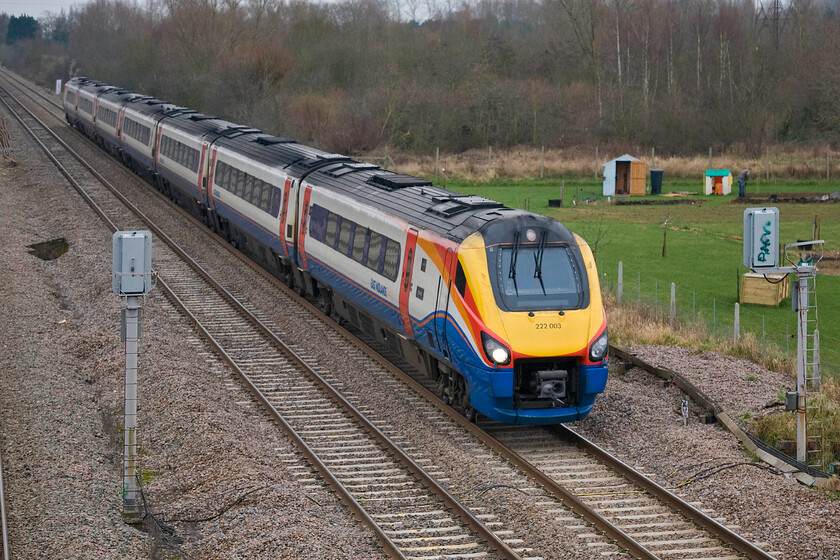 222003, EM 12.25 London St. Pancras-Sheffield, Lower Farm Road, Bromham TL028518 
 East Midlands Railway Meridian 222003 'Tornado' passes near the village of Bromham just north of Bedford working the 12.25 St. Pancras to Sheffield service. The leading car of the set carries the number 60163, the same as the new-build Peppercorn A1 hence its shared name. 
 Keywords: 222003 12.25 London St. Pancras-Sheffield Lower Farm Road Bromham TL028518 Tornado EMR Meridian