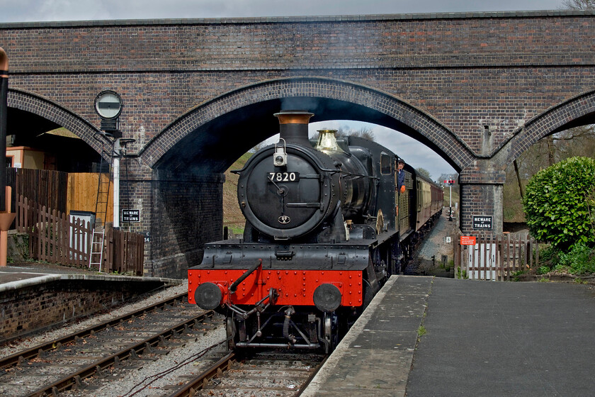 7820, 12.35 Broadway-Cheltenham Racecourse, Toddington station 
 In the custodianship of the Dinmore Manor Locomotive Limited, 7820 'Dinmore Manor' has been one of the most dependable and regular performers on the Gloucestershire and Warwickshire Railway over a number of years. In a rather head-on shot the Manor is seen arriving at Toddington station leading the 12.35 Broadway to Cheltenham Racecourse service. Despite it being a relatively ordinary Thursday early in the season the platform behind me was busy with visitors and the train was already well loaded; all very encouraging! 
 Keywords: 7820 12.35 Broadway-Cheltenham Racecourse Toddington station Dinmore Manor