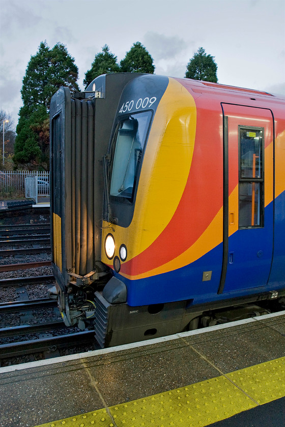 450009, SW 15.12 London Waterloo-Basingstoke (2L45), Fleet station 
 A feature of modern train unit builds is that one 'parent' design morphs many variants with a lot looking very similar. This creates huge cost savings for manufactures in terms of design and toolings costs but does make things a little more boring for enthusiasts! The Seimens Desiro is an excellent example of this integrated and family design with many variants to suit the needs of different operators. 450009 pauses at Fleet station working the 15.12 Waterloo to Basingstoke. SWT service. 
 Keywords: 450009 SW 15.12 London Waterloo-Basingstoke 2L45 Fleet station SWT South West Trains Desiro