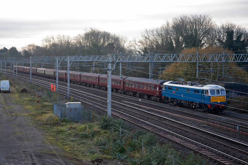 86259, outward leg of The Cathedrals Express, 07.10 London Euston-Holyhead (1Z31), site of Roade station 
 86259 'Les Ross/ Peter Pan' takes the down fast past the site of Roade station with the the 1Z51 07.10 Euston to Holyhead Cathedrals Express. The vintage AC electric lead the train as far as Crewe where Black 5 45699 took overs and lead the train to Holyhead. 
 Keywords: 86259 The Cathedrals Express 07.10 London Euston-Holyhead 1Z31 site of Roade station