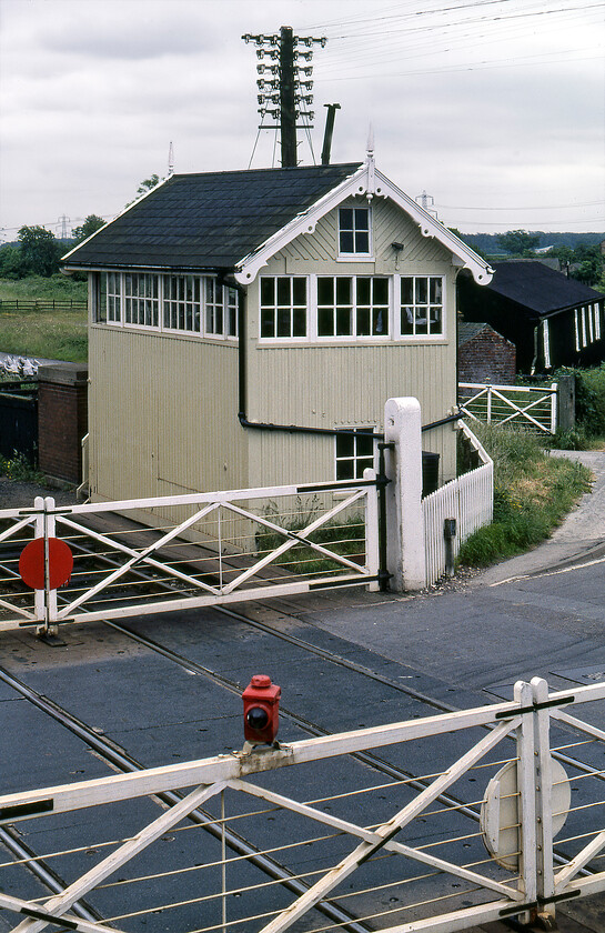 Habrough Junction signal box (MS&LR, 1883) 
 Habrough signal box was located at the end of the station platform and controlled the level crossing and its associated signalling. It was a Manchester Sheffield & Lincolnshire Railway Company type 2 design that opened in 1883, replacing an earlier box at this location. It was shut in September 1988 with AHBs replacing the superb wooden gates seen in this image. Remote control of the crossing moved to the nearby Ulceby signal box. 
 Keywords: Habrough Junction signal box MS&LR